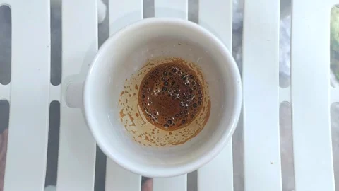 Coffee Cup on White Striped Table Stock Footage 297073649