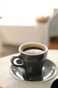 Coffee cup in white table Stock Photos