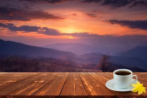 Coffee cup on wood table and view of beautiful nature background Stock Photos