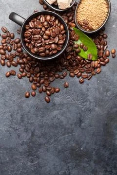 Coffee cups and roasted beans Stock Photos