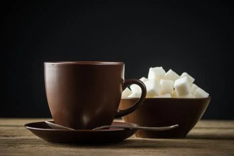 Coffee cups, beans and sugar Stock Photos