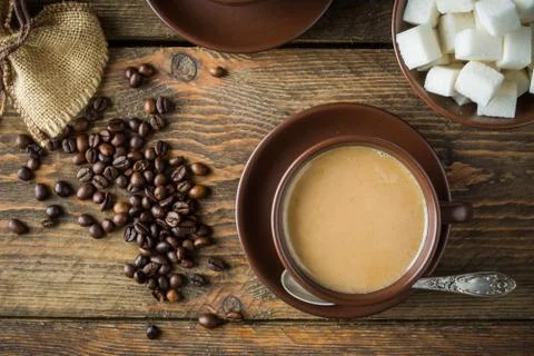 Coffee cups, beans and sugar Stock Photos
