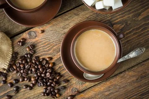 Coffee cups, beans and sugar Stock Photos