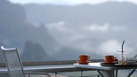 Coffee Cups on Cafe Balcony with Mountain Fog View Calm Morning Atmosphere Video stock 325237057