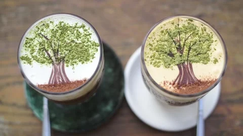 Coffee Cups With Decorative Toppings. Overhead View Of Coffee Drinks On Wooden Stock Footage 331562464