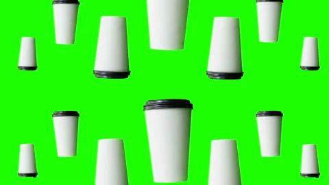 Coffee cups loop on green background Stock Footage 133325956
