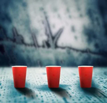 Coffee cups on melting ice surface Foto stock