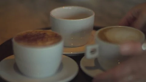 Coffee cups placed on tray Stock Footage 99354392