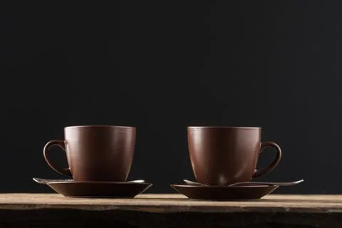 Coffee cups on rustic wooden table Stock Photos