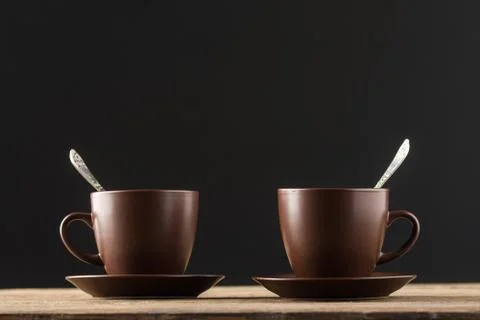 Coffee cups on rustic wooden table Stock Photos