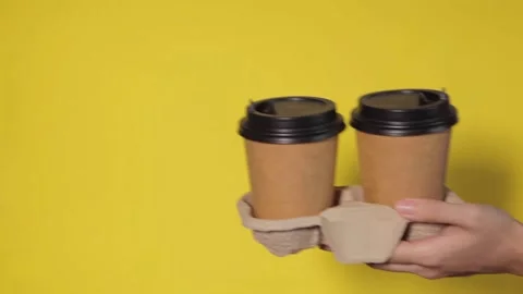 Coffee delivery against yellow background Video stock 158923366
