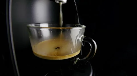 Coffee dispenser with cup of coffee.  Video stock 61196544