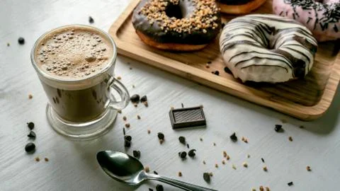Coffee with donuts of different flavors. Appetizing donuts. Stock-Fotos
