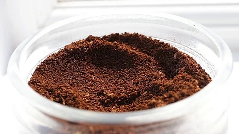 Coffee dosage from a jar with a small spoon 스톡 동영상 74864488