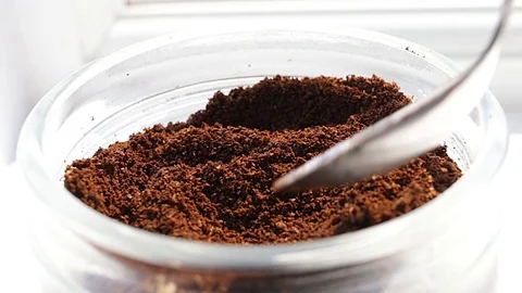 Coffee dosage from a jar with a small spoon Stock Footage 74864801