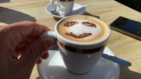 Coffee with drawn smiley face concept morning happiness cappuccino Vídeos de archivo 236123771
