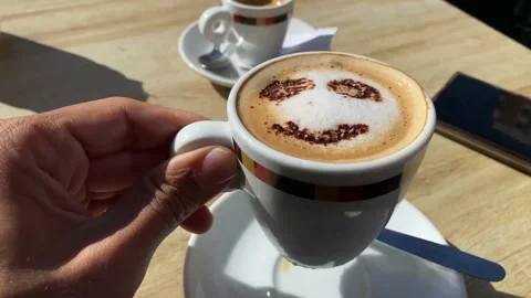 Coffee with drawn smiley face concept morning happiness cappuccino Stock Footage 236123777