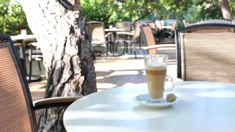 Coffee drink latte or flat white, in a transparent glass with cookie or biscuit  Stock Footage 162390772