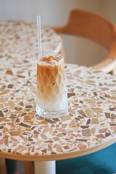 Coffee drink on a table in a cafe setting Stock Photos