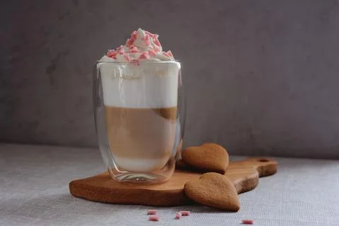 Coffee drink on a wooden board on a solid background. Stock Photos