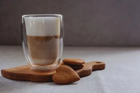 Coffee drink on a wooden board on a solid background. Foto stock
