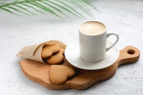 Coffee drink on a wooden board on a solid background. Stock Photos