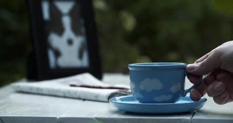 Coffee drinking outside in the garden day 4K Stock Footage 309879706