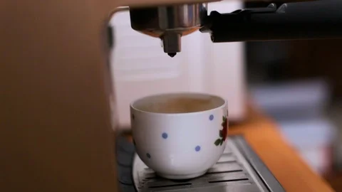 Coffee drip coffee machines dripping into a white cup Stock Footage 107411588