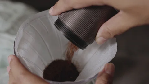 Coffee Drip Concept. Pouring Coffee Ground into a Drpper. Making Hot Coffee D Stock Footage 130048076