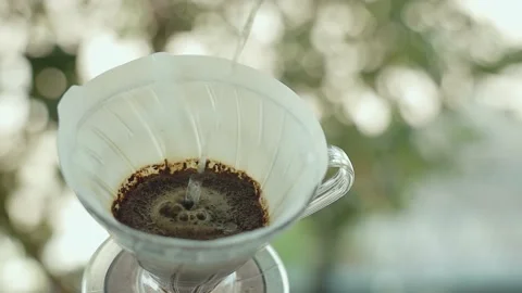Coffee Drip Concept. Pouring Hot Water from Kettle into a Dripper. Making Hot Stock Footage 130953155