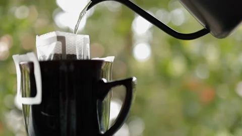 Coffee Drip Concept. Pouring Hot Water from Kettle into a Dripper. Making Hot Stock Footage 133160544
