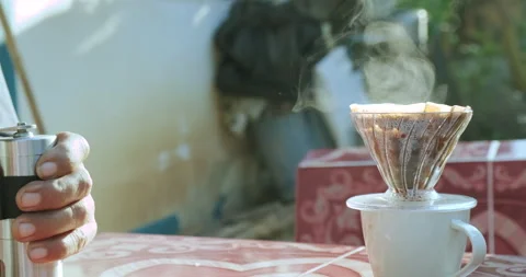 Coffee drip in mornign with light people hand Stock Footage 151457318