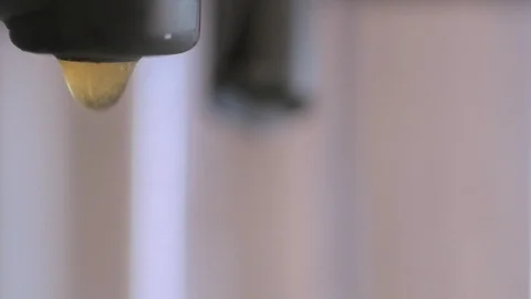 Coffee Dripping From a Coffee Machine Stock Footage 124125698