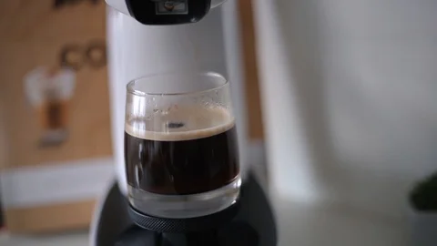 Coffee dripping from the machine into the cup Stock Footage 101922802