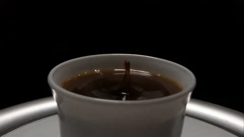 Coffee Drop Falling into Cup, Super Slow Motion Close-Up 動画素材 143998682