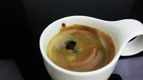 Coffee drop falling in slow motion inside of cup of espresso italian coffee Stock Footage 74452273