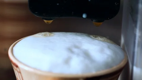 Coffee drop into the filled cup, making cappuccino Stock Footage 124530754