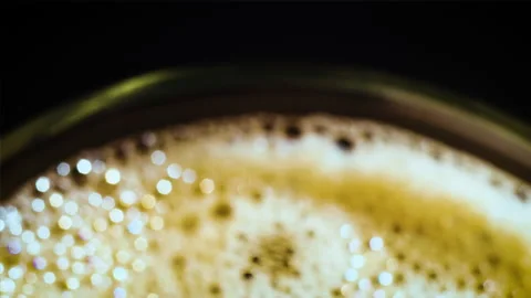Coffee drop into the filled glass in slow motion. Stock Footage 162128129