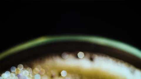 Coffee drop into the filled glass in slow motion. Stock Footage 162128337