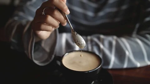 Coffee drop on the latte coffee cup cinemagraph Stock Footage 106074086