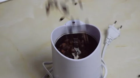 Coffee dropped in grinder Stock Footage