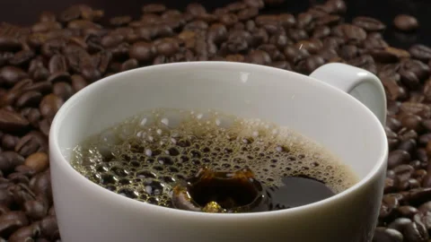 Coffee drops falling into a cup Stock Footage 316072352