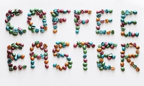 Coffee Easter. Lettering made of multi-colored pearl coffee beans on white Foto stock