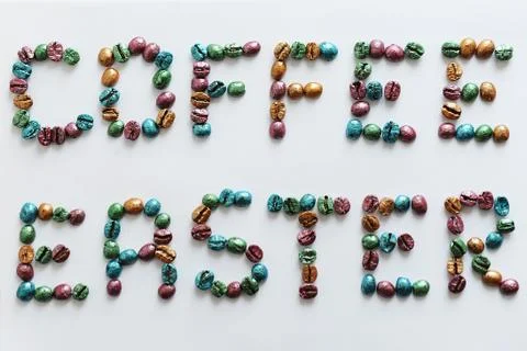 Coffee Easter. Lettering made of multi-colored pearl coffee beans on white Stock Photos