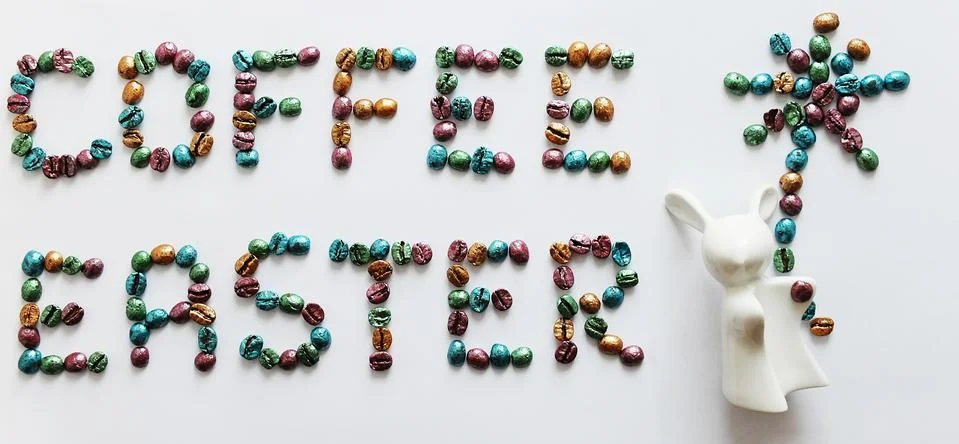 Coffee Easter. Lettering made of multi-colored pearl coffee beans on white Stock Photos