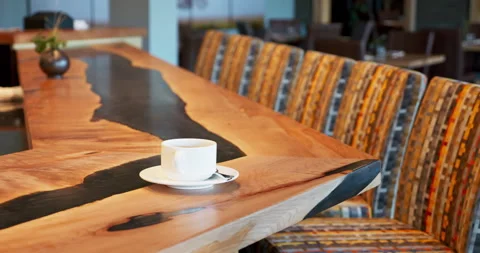 Coffee espresso cup sitting on an empty bar top in a nice restaurant. Custom Stock Footage 232340151