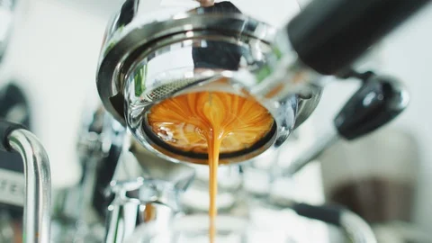 Coffee espresso machine perfect extraction pouring from bottomless naked Stock-Footage 128343349