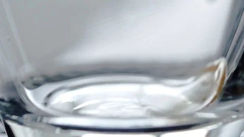 Coffee falling into the cup in super slow motion Stock Footage 82004708