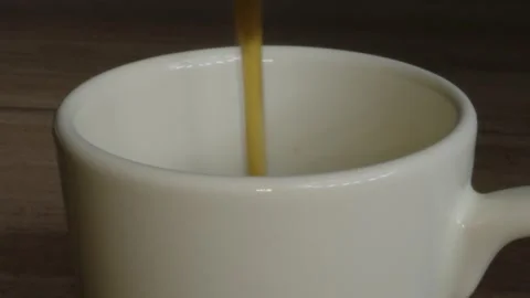 Coffee filled into the ceramic cup Stock Footage 243301573