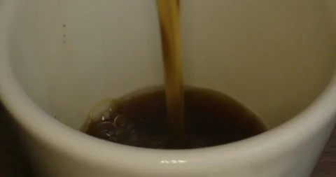 Coffee filled into the ceramic cup Stock Footage 243301633